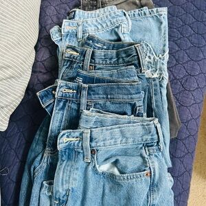 Stack of Classic Light and Medium Wash Denim Jeans